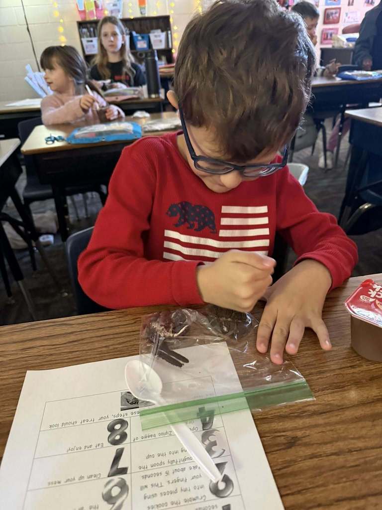 student crushing Oreos