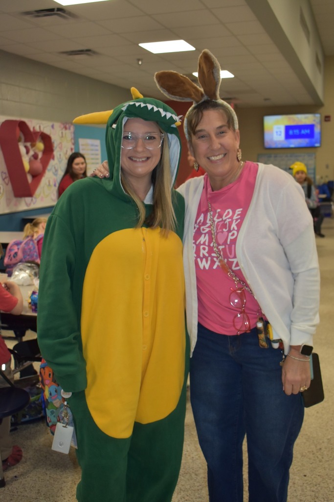 teachers dressed up as a dragon and as a rabbit