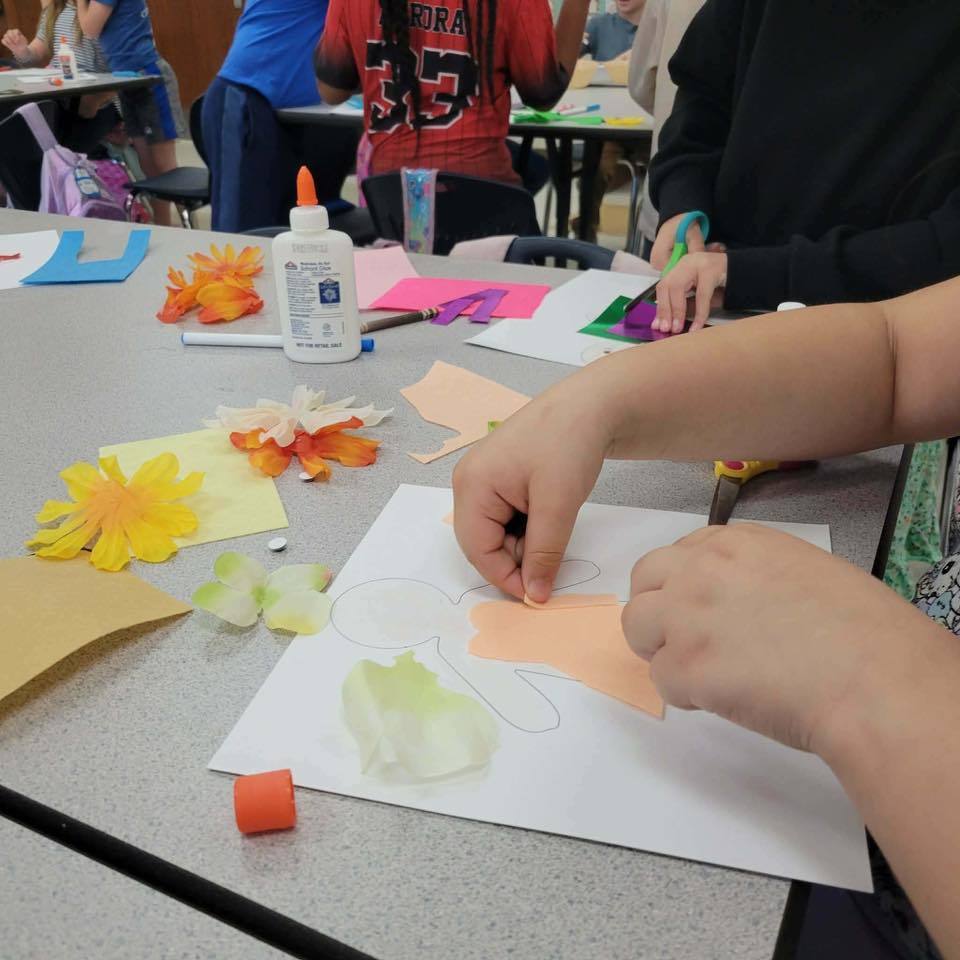 students working on assignment by glueing