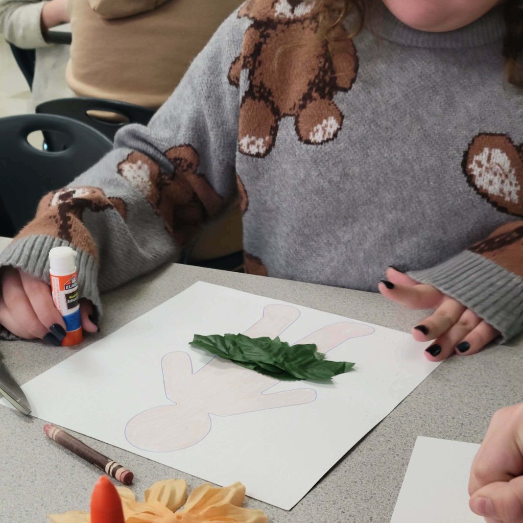 students working on assignment by glueing