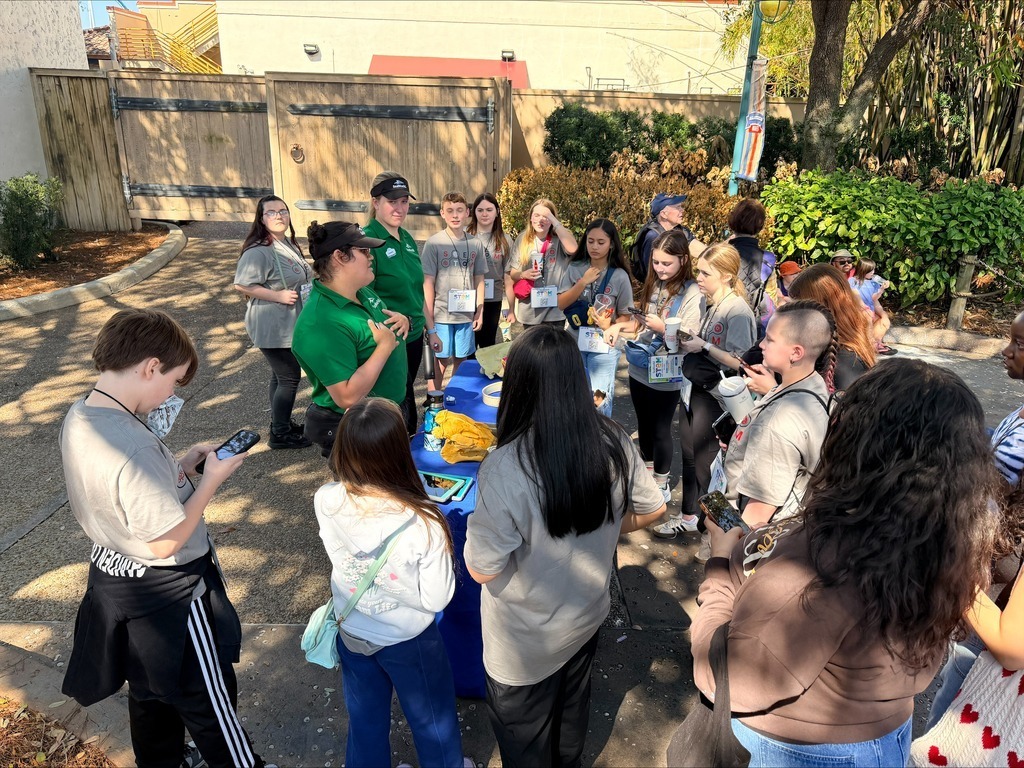 students at table learning from sea world workers