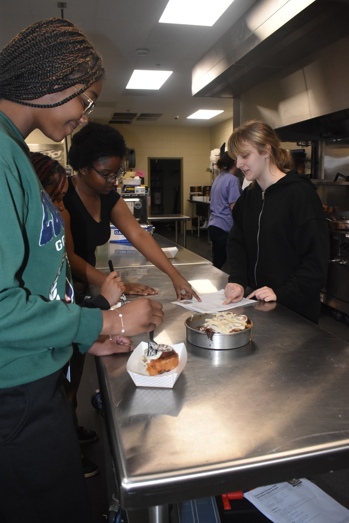 students looking at recipe