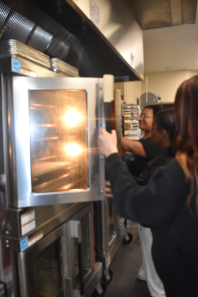students working with ovens