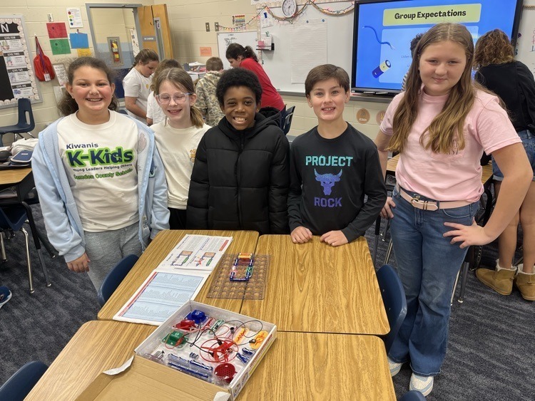 group photo of students with their project