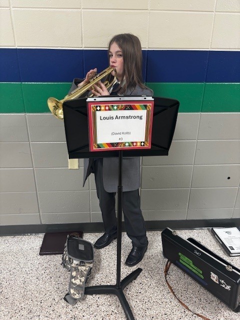 student dressed up as Louis Armstrong
