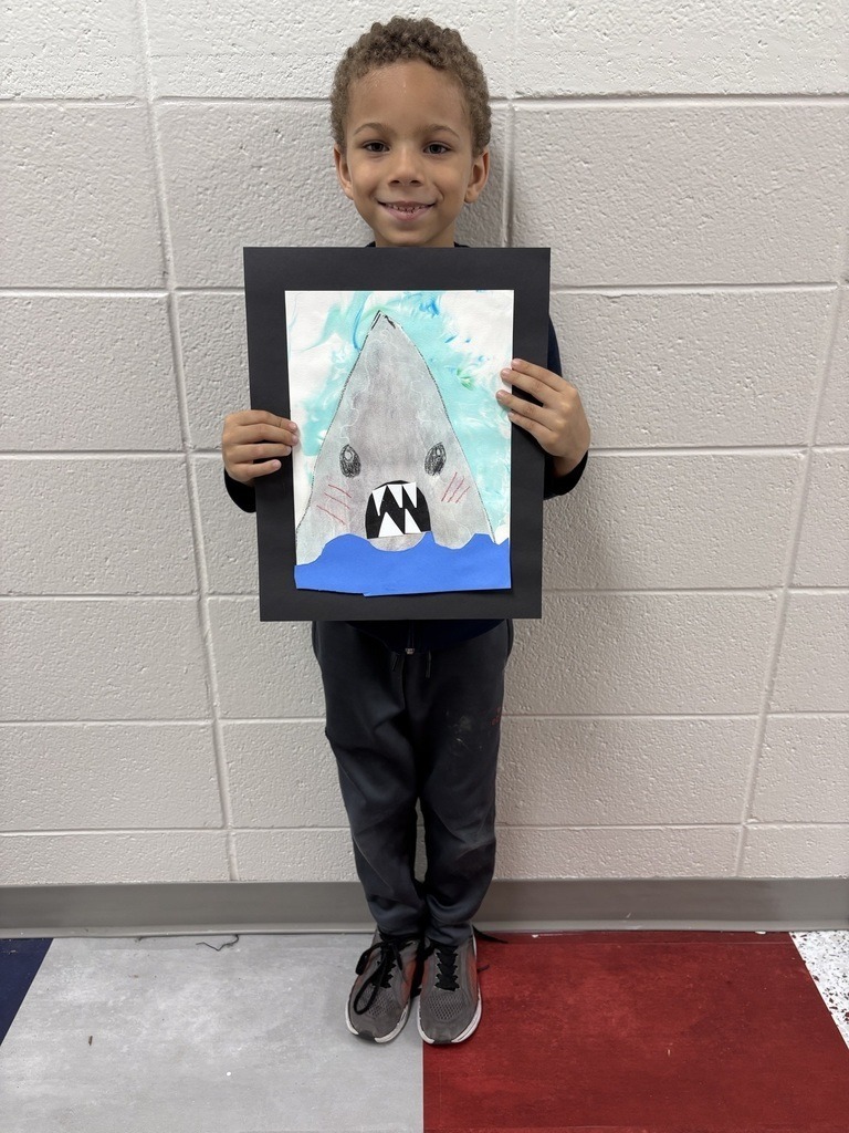 student with their artwork