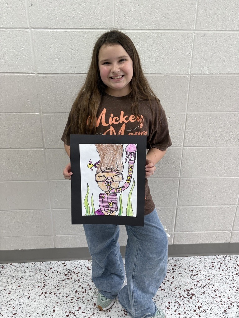 student with their artwork
