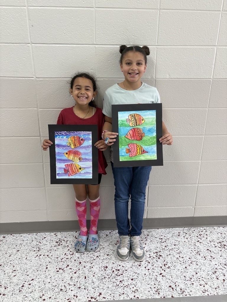 student with their artwork