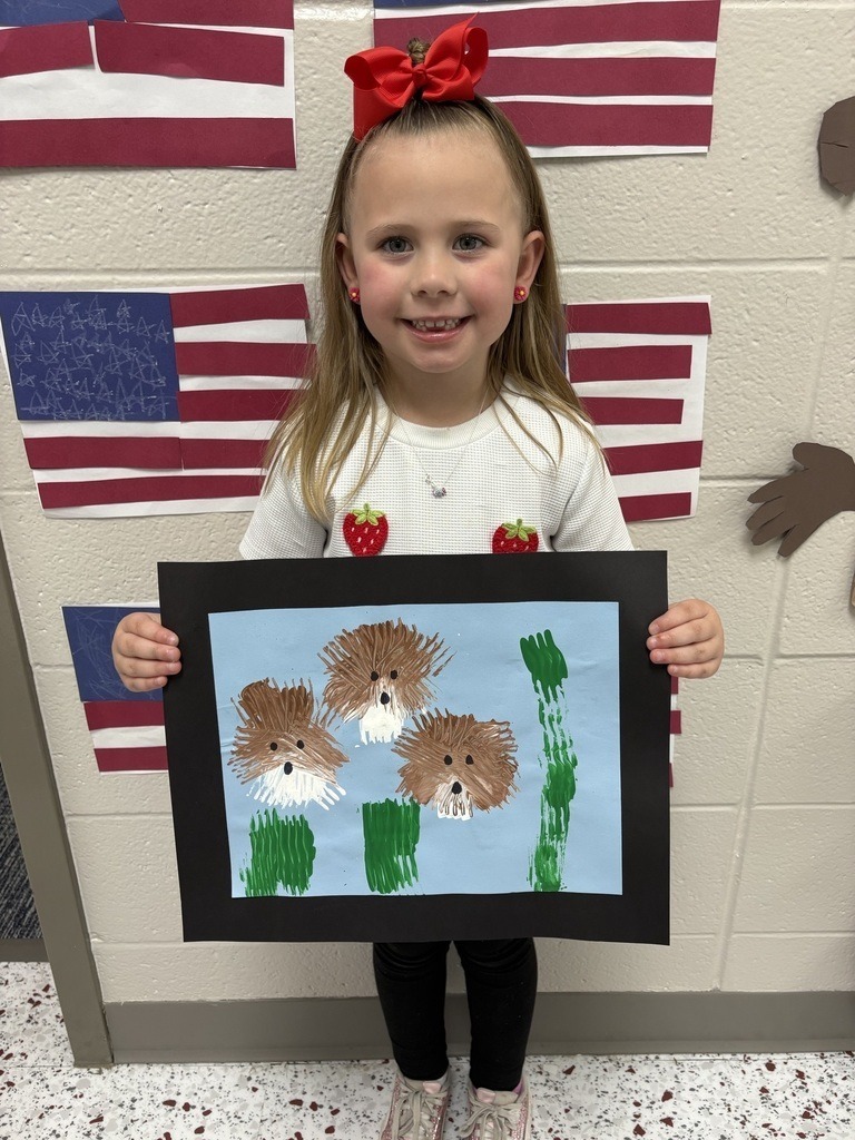 student with their artwork