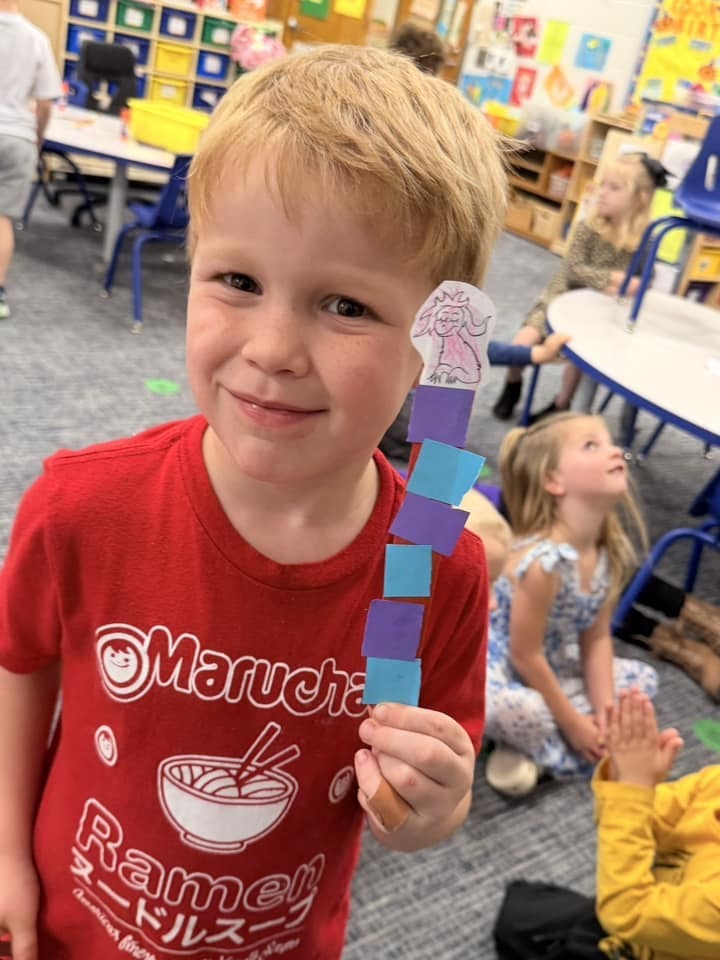 student holding project