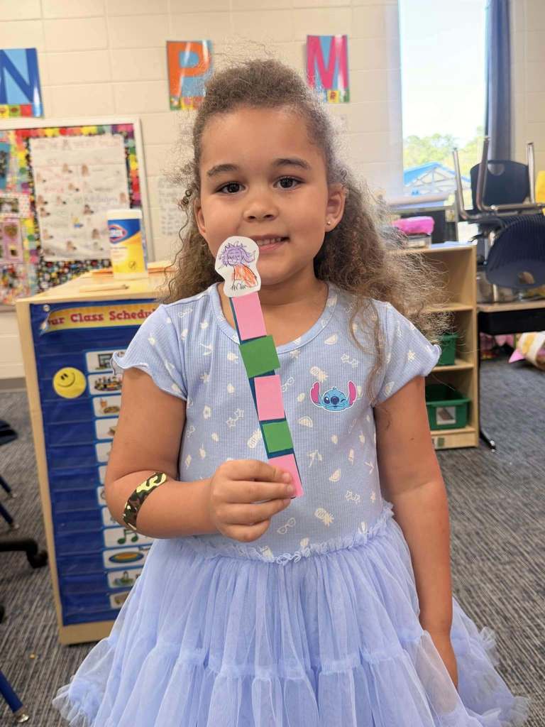 student holding project