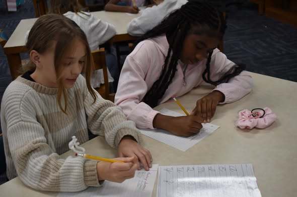 student working on handwriting