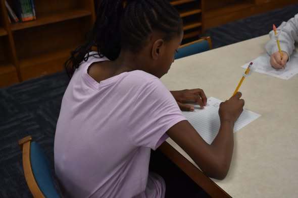 student working on handwriting
