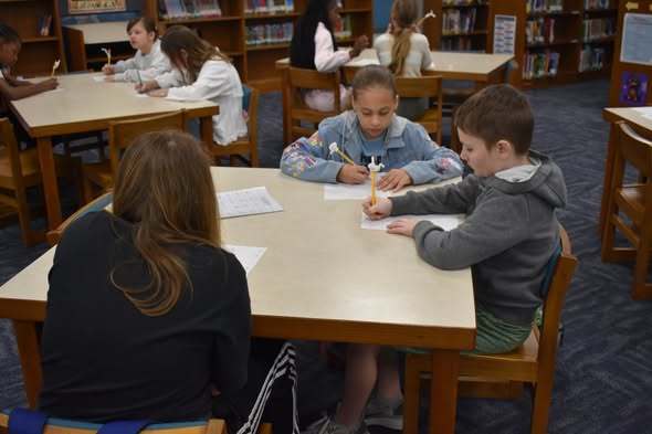 student working on handwriting