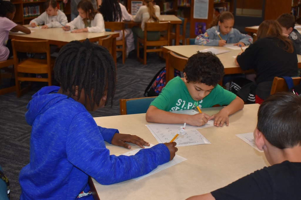 student working on handwriting