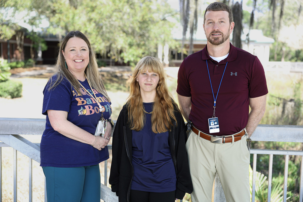 brianna ogle with principal and teacher