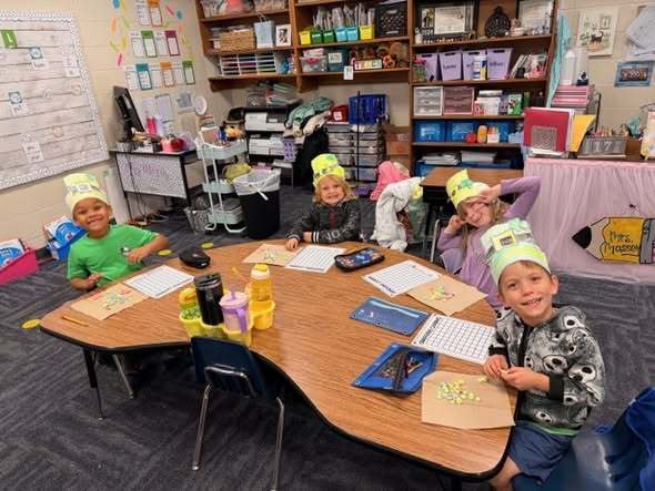 students at their tables doing assignment