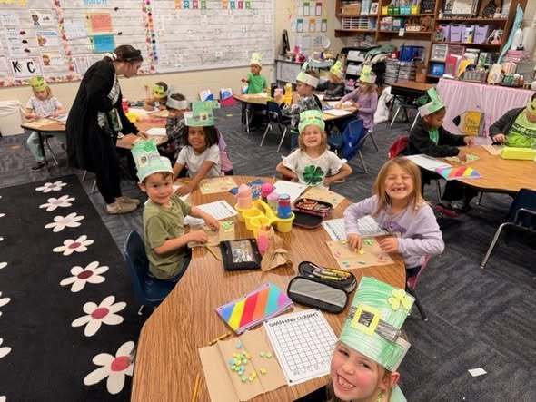 students at their tables doing assignment