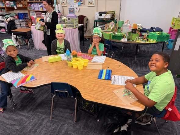 students at their tables doing assignment
