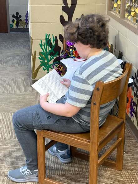 student reading book