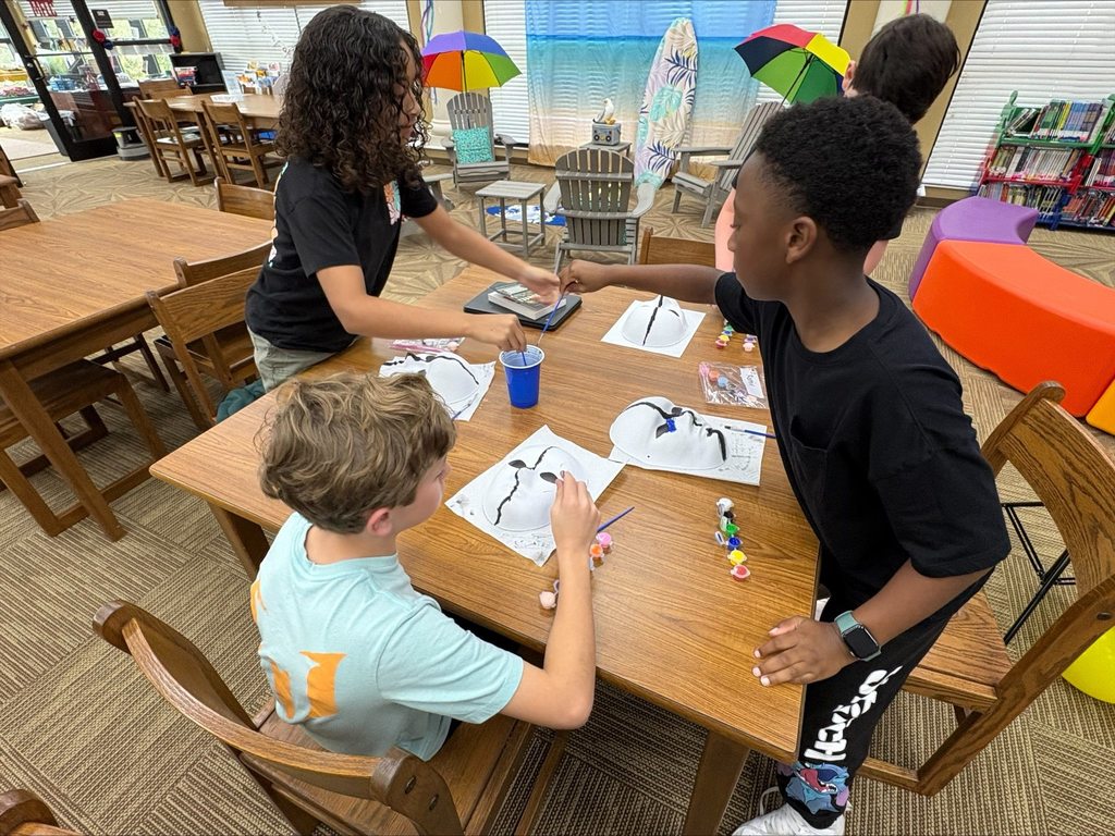 students painting masks
