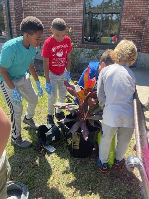 students potting plants