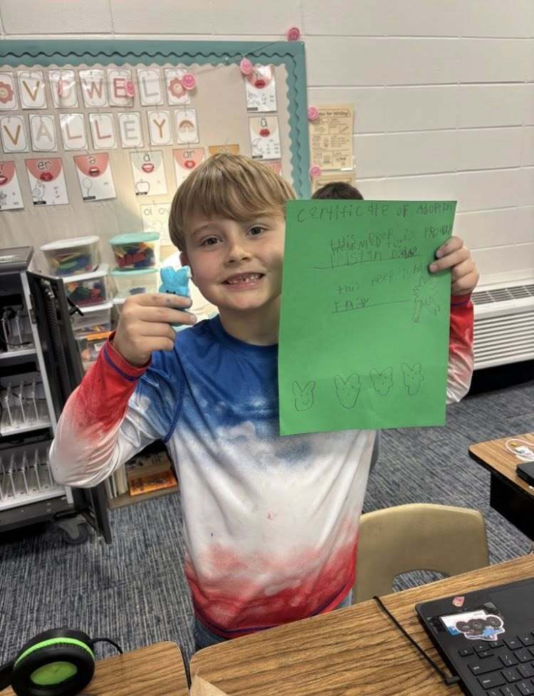 student with his paper about his peep and his peep