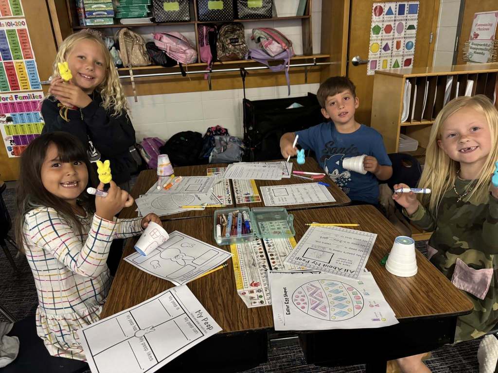 students at table working on all about their peep papers