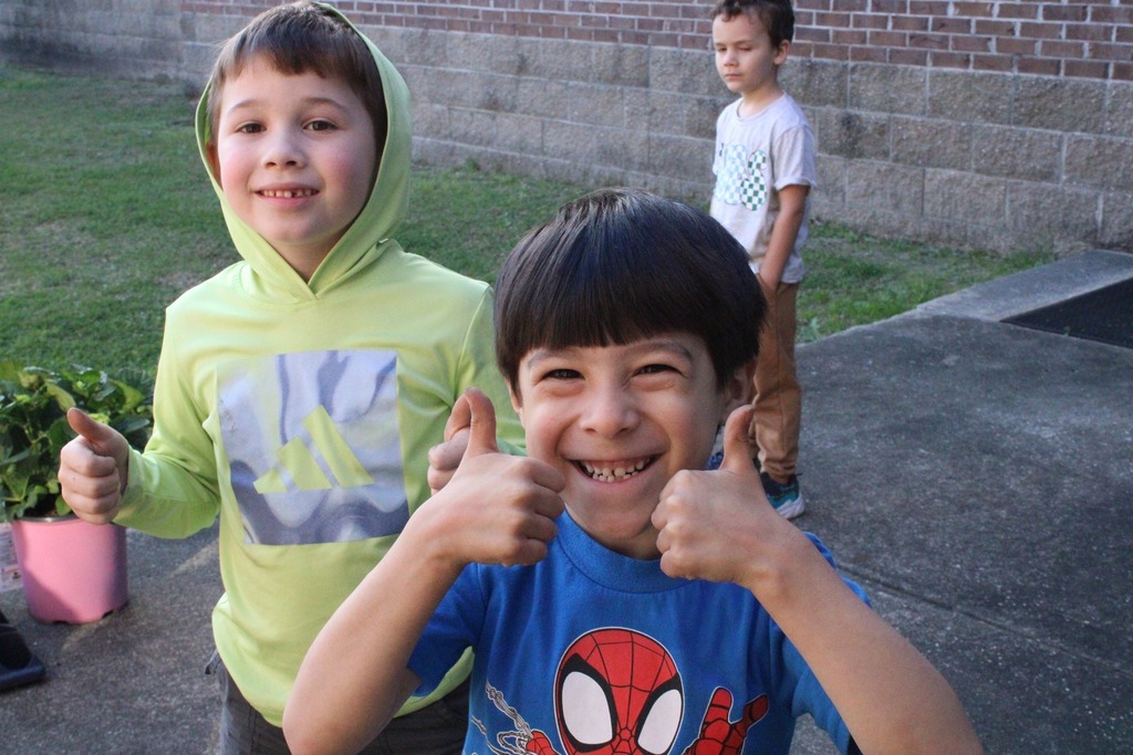 students smiling into camera