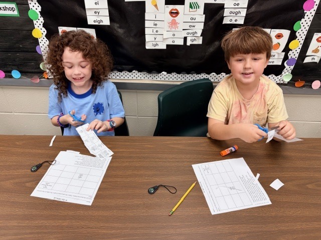 students practice using a compass rose