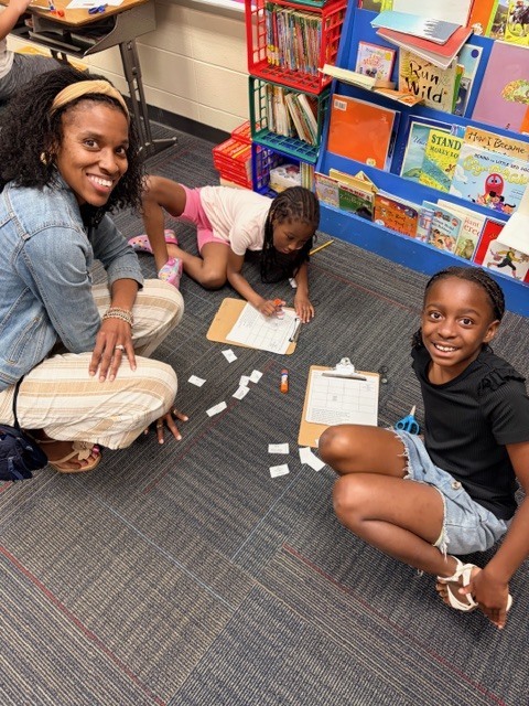 students practice using a compass rose