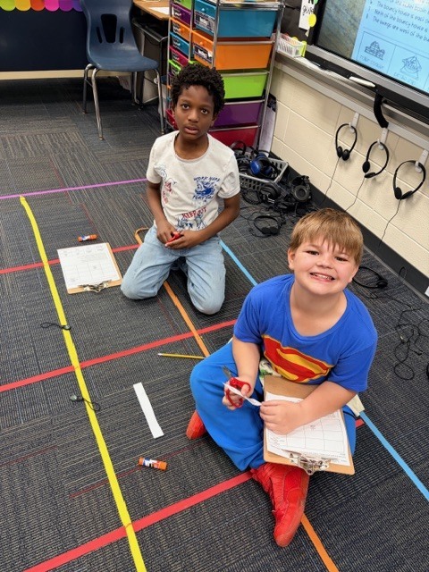 students practice using a compass rose