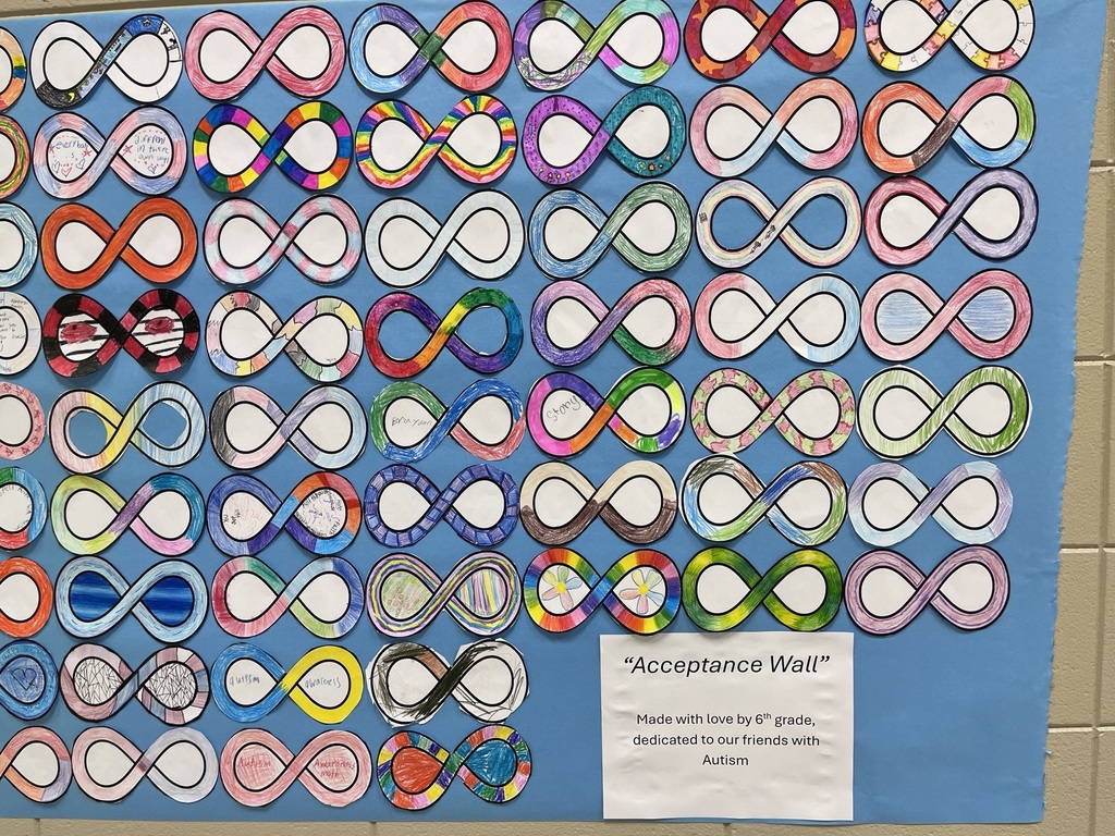 6th grade math students decorated infinity symbols to create an Acceptance Wall for Autism Awareness Month.