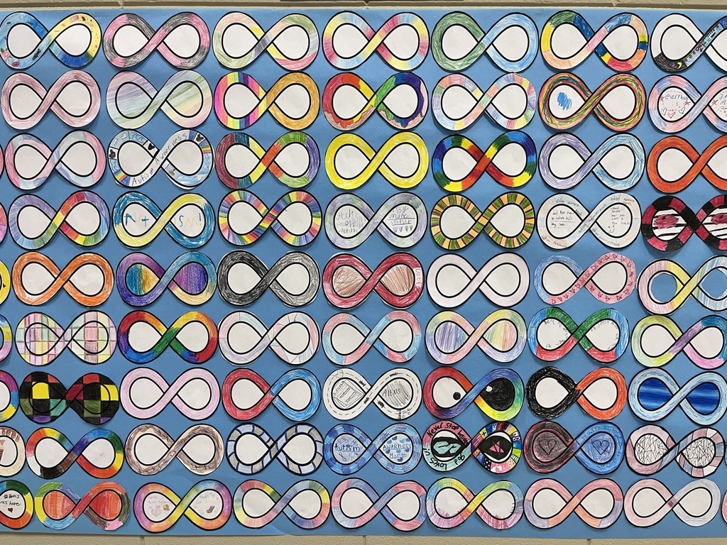 6th grade math students decorated infinity symbols to create an Acceptance Wall for Autism Awareness Month.