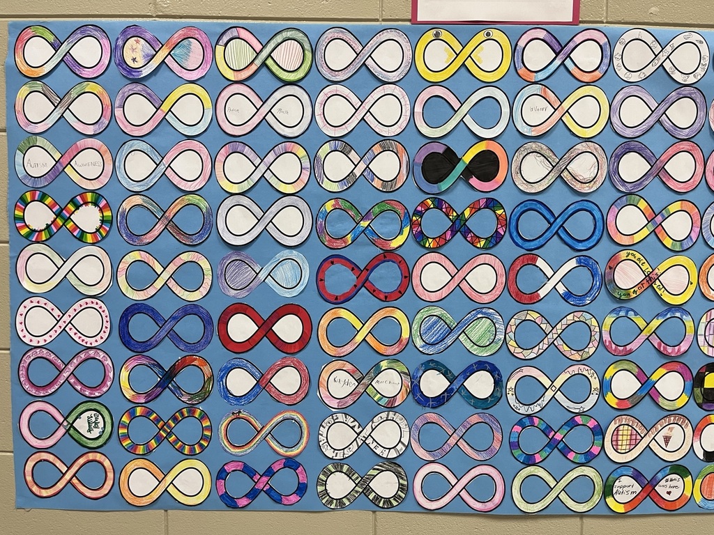 6th grade math students decorated infinity symbols to create an Acceptance Wall for Autism Awareness Month.