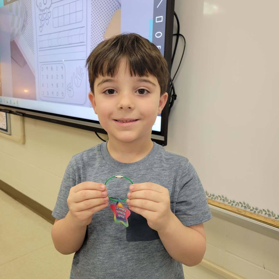 student with brag tag