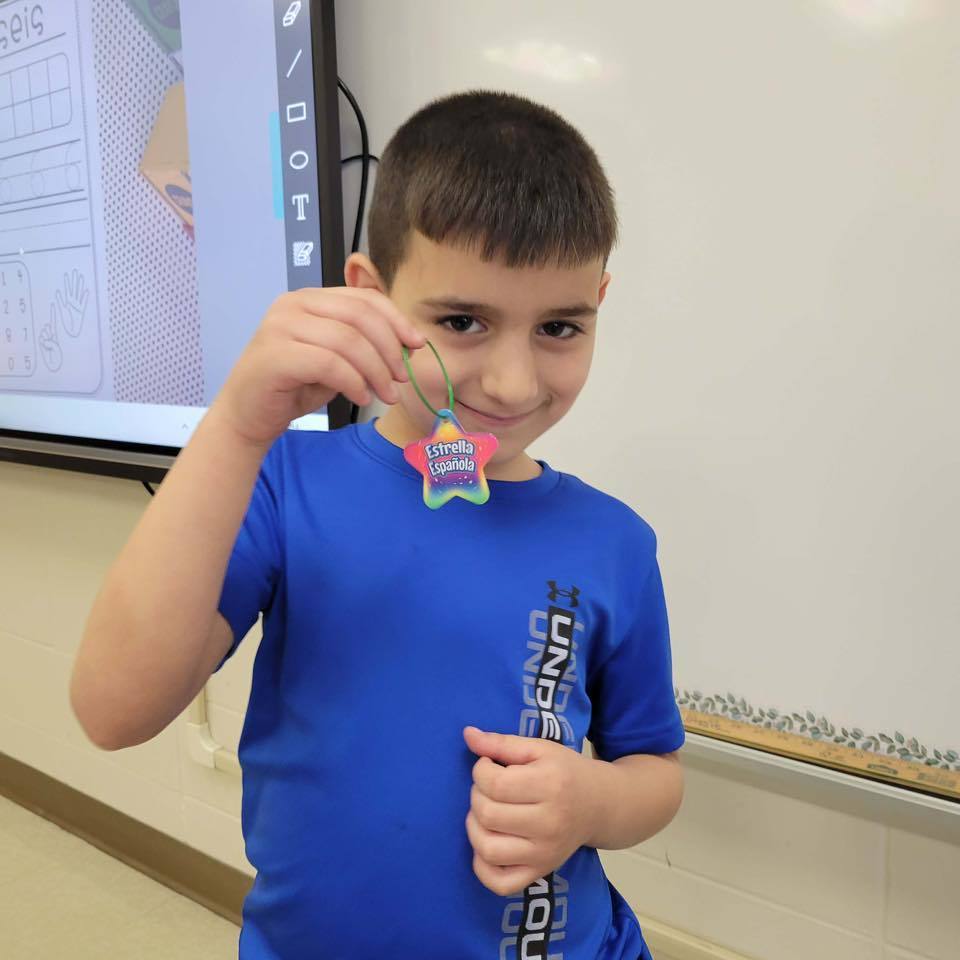 student with brag tag