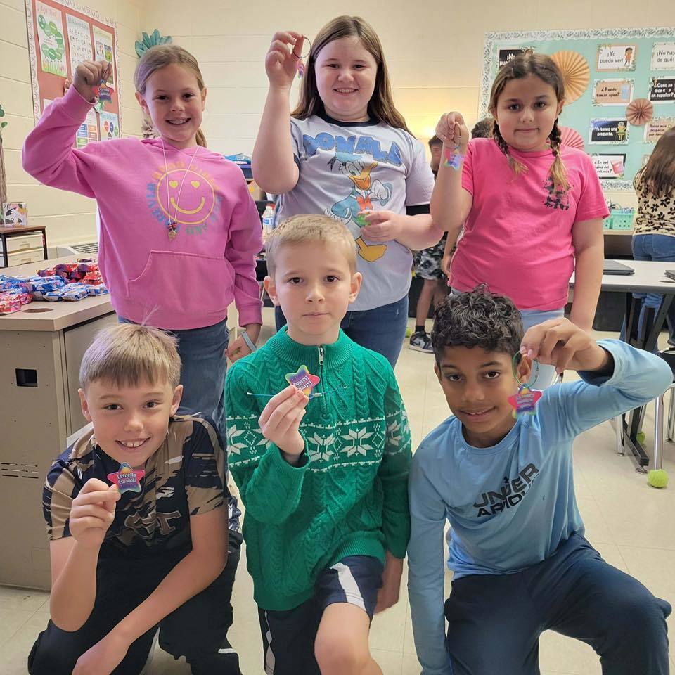 students with brag tags