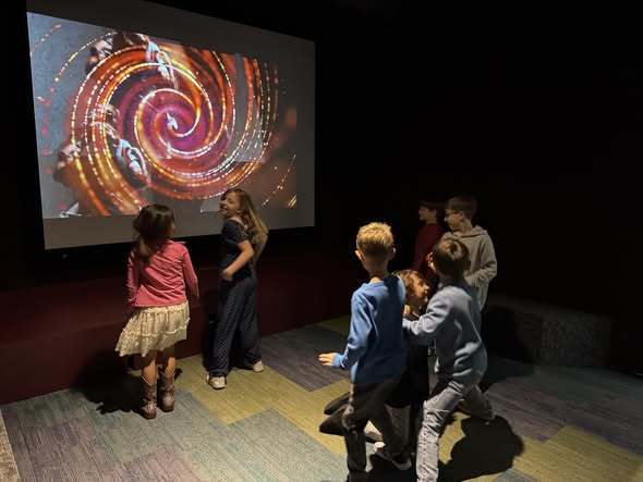 students looking at artwork