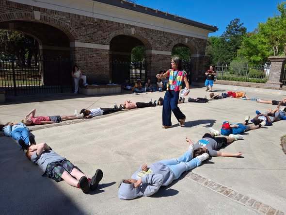 teacher helping students form a rectangle