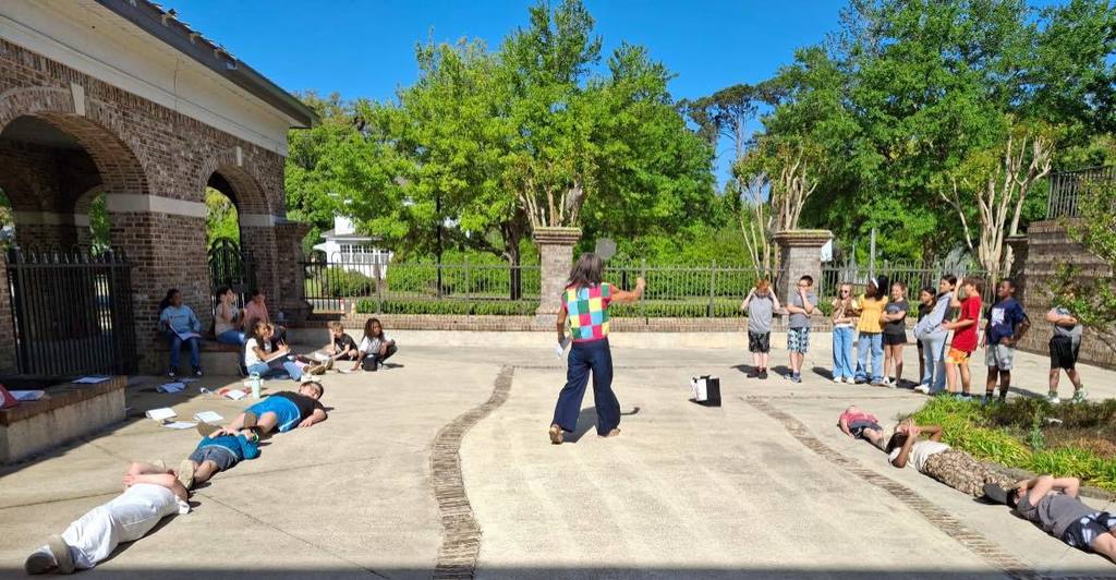teacher helping students form a rectangle