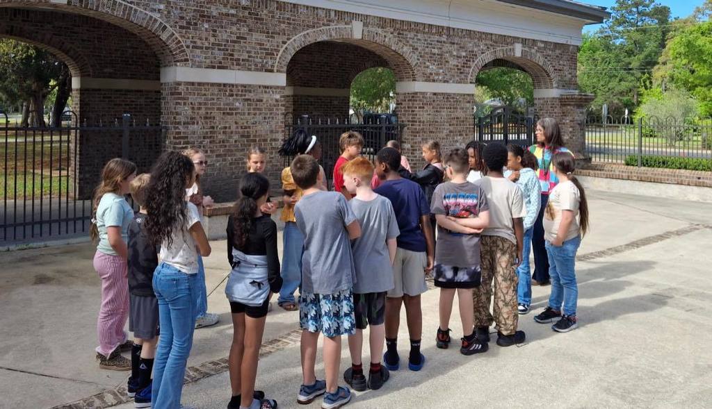 students listening to teacher
