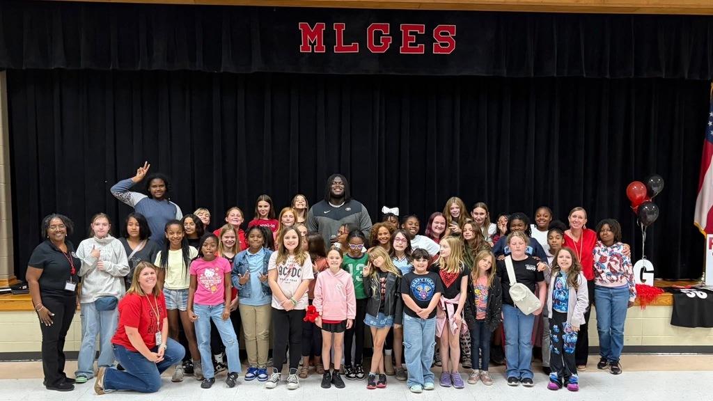 group photo with micah and students