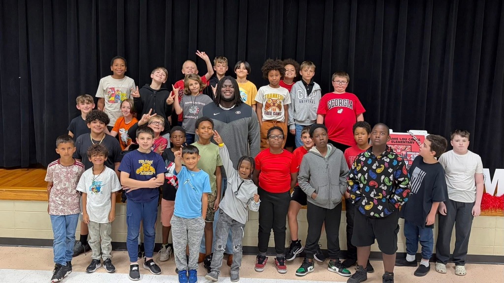 group photo with micah and students
