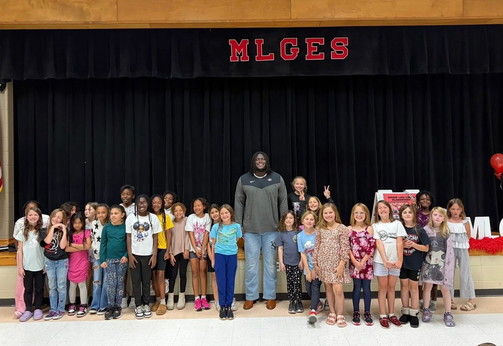 group photo with micah and students