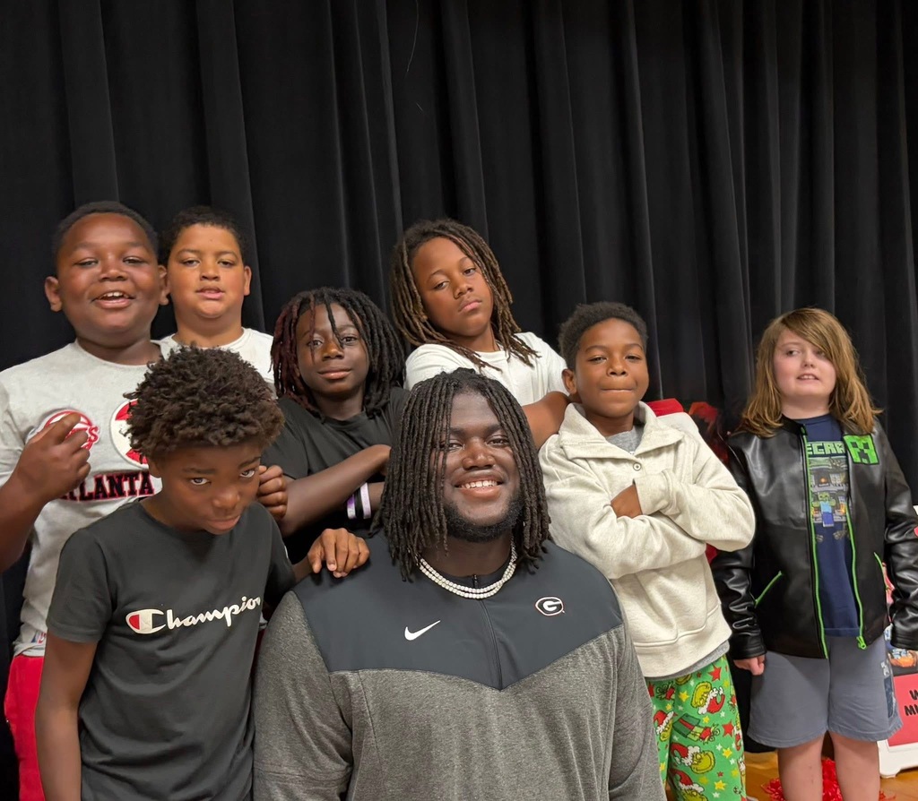 group photo with micah and students