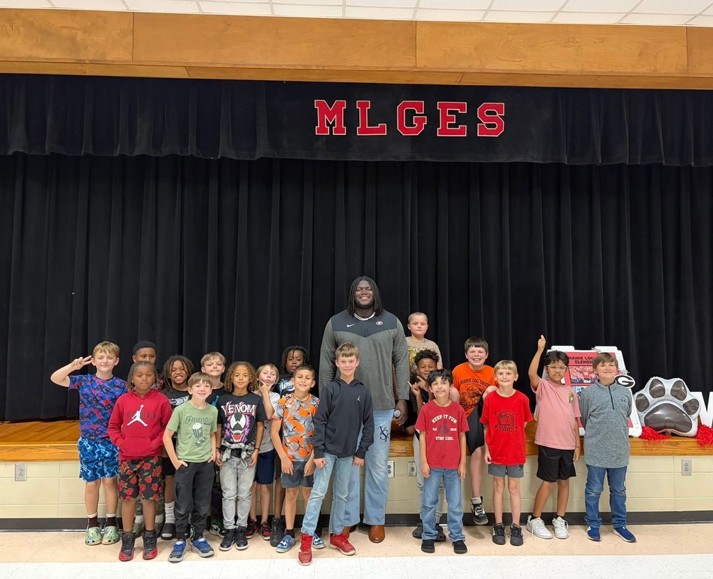 group photo with micah and students