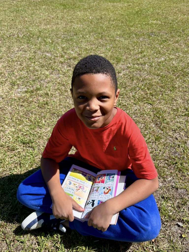students reading outside