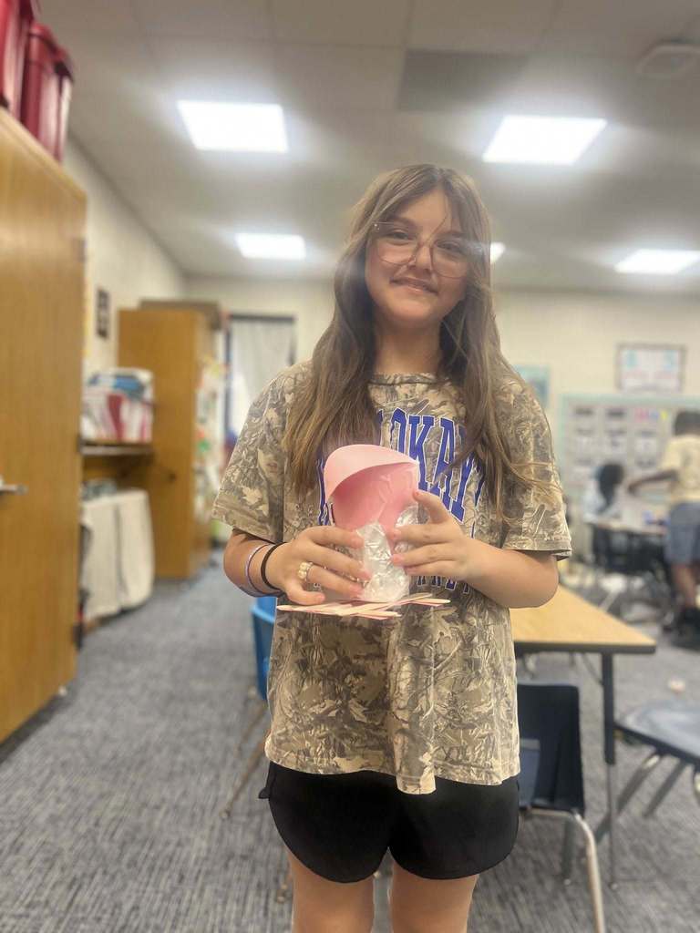 student showing their finished project