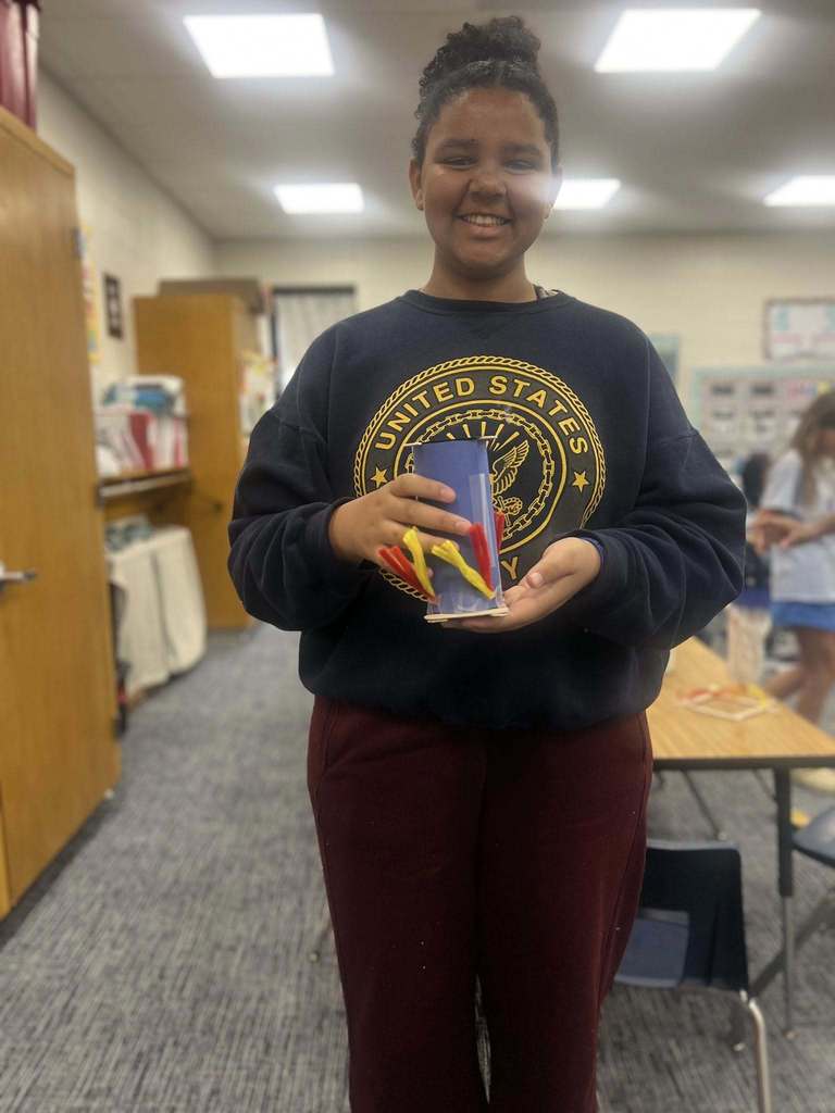 student showing their finished project